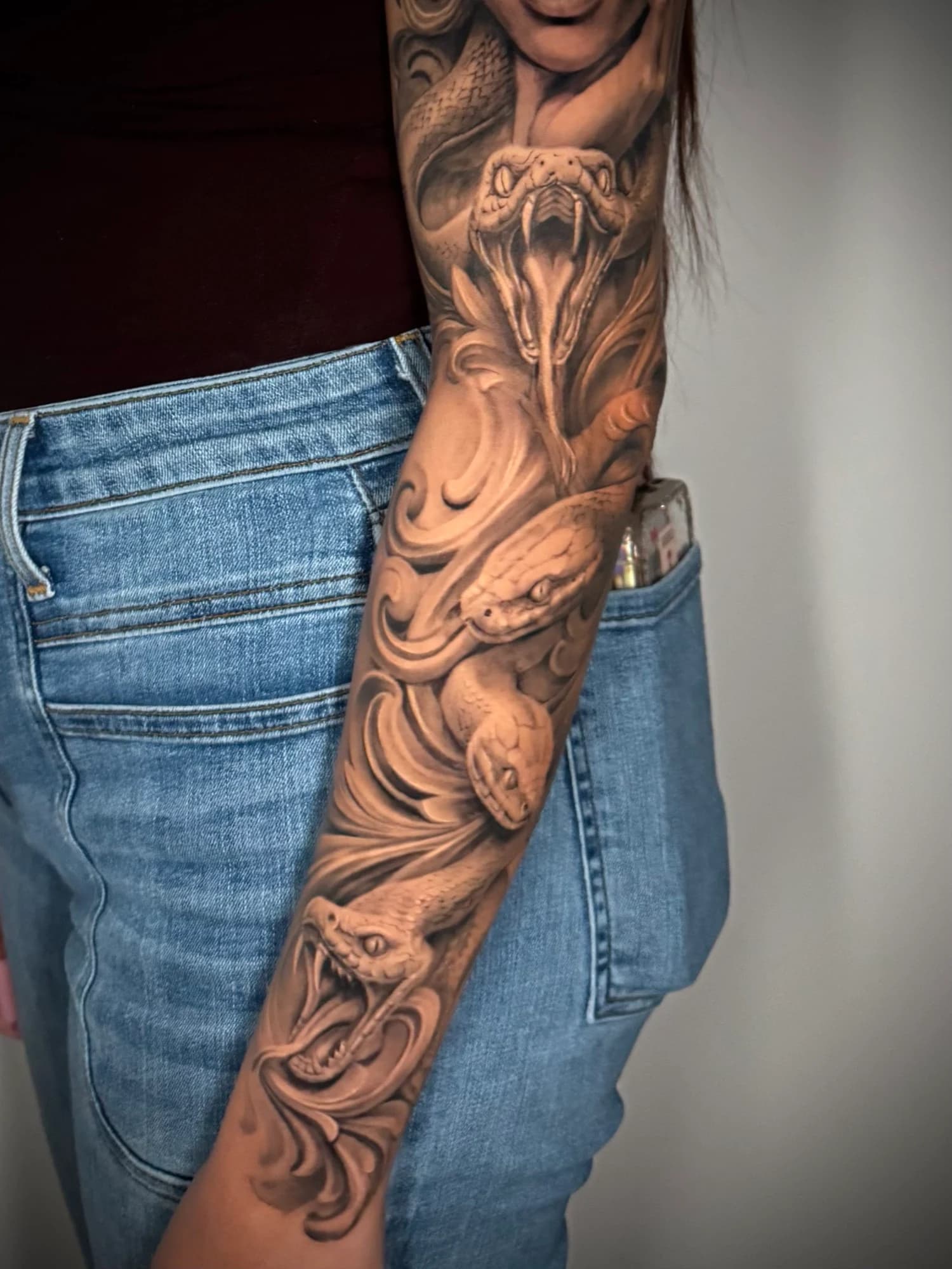 Black and grey tattoo: snake details from the Medusa sleeve.