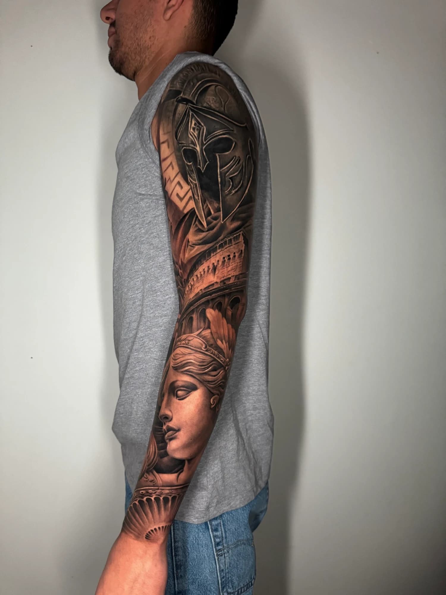 Black and grey tattoo: full view of the classical portraits and architectural sleeve.
