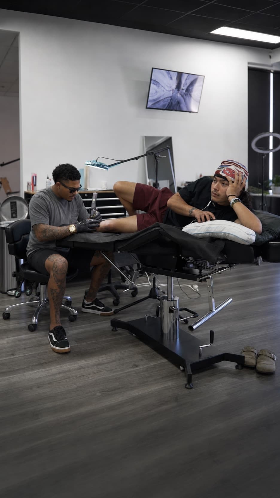 Roly tattooing a client during a private appointment